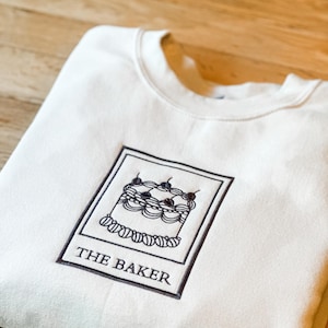 Embroidered 'The Baker' Tarot Sweatshirt: Vintage Cake Design
