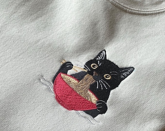 Ramen Cat Embroidered Sweatshirt Hoodie | Kawaii Foodie Crewneck | Black Cat Lover Gift | Cute Japanese Noodle Zip Up Pullover Sweater