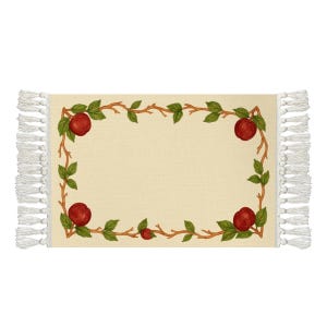 May include: Beige rectangular rug featuring a border of red apples, green leaves, and brown branches. White fringe adorns the short ends. The design has a botanical theme.