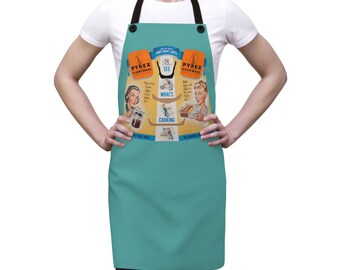 May include: A turquoise blue apron with a vintage Pyrex advertisement featuring three women cooking. The text on the apron reads "See What's Cooking!" and "Pyrex Flameware" and "Pyrex Ovenware".