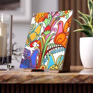 May include: A colourful folk art style painting of birds and flowers. The birds are yellow, blue, orange, and pink. The flowers are red, yellow, green, and pink. The background is white.