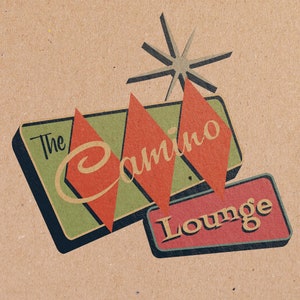 May include: Retro-style sign with a green background and red diamond shapes. The sign reads "The Camino Lounge" in a stylized font.
