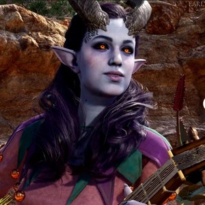 May include: A digital illustration of a fantasy character with blue skin, pointed ears, and horns. The character wears a pink and purple jester-style outfit with gold accents and holds a stringed instrument. The eyes glow orange, and the hair is dark purple.