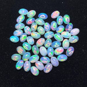 Ópalo natural de Etiopía de alta calidad, tamaño 6 x 4 mm, forma ovalada, gema para la fabricación de joyas.