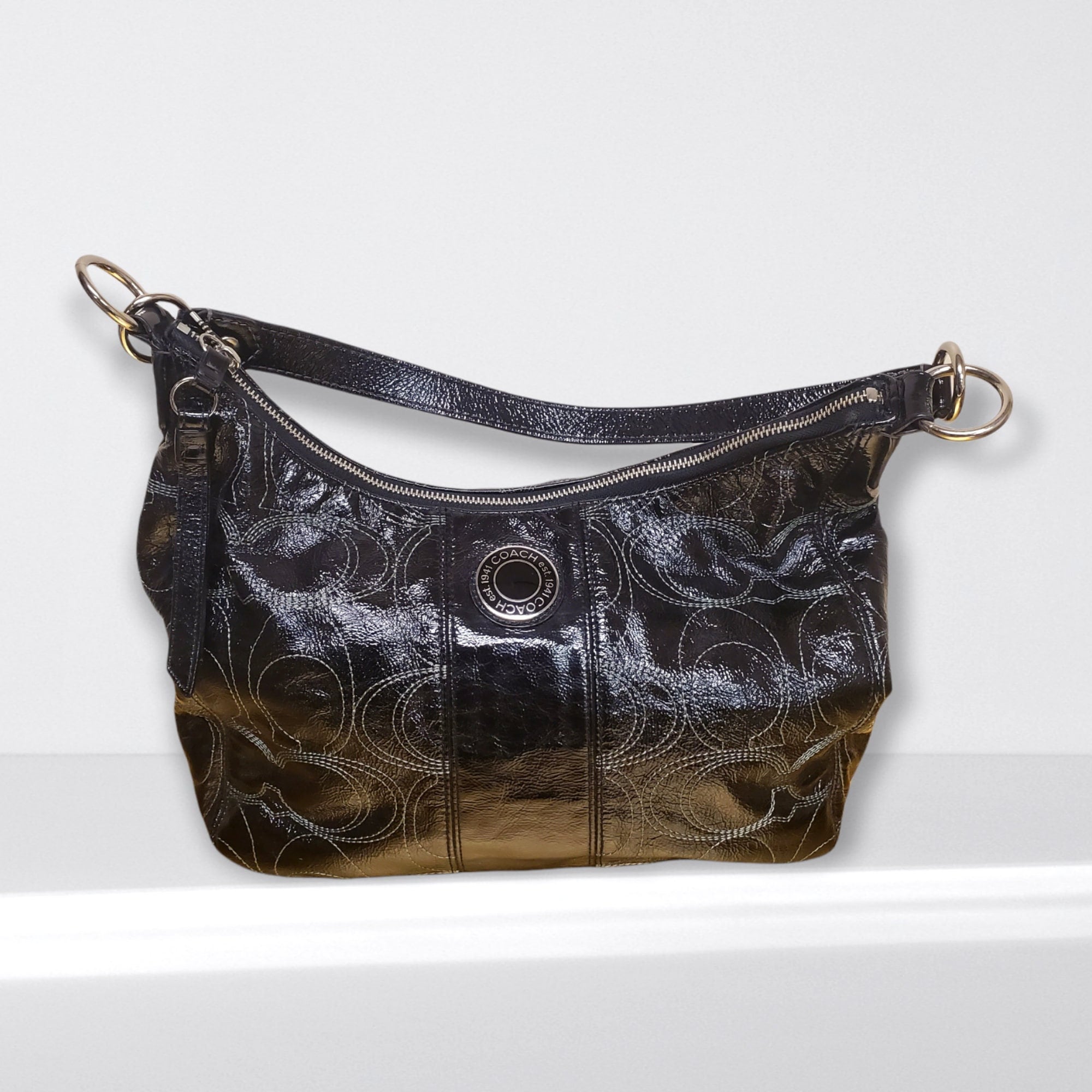 Black patent coach purse hot sale