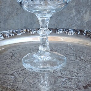 May include: A set of three ceramic mugs with a speckled, matte finish. The mugs are in shades of cream, light gray, and dark gray. Each mug has a simple, minimalist design and a rounded handle.