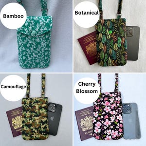 May include: Four different phone crossbody bags. The bags feature various patterns: green bamboo, botanical print, camouflage, and cherry blossom. Each bag has a matching strap and a snap closure. A passport and phone are next to each bag.