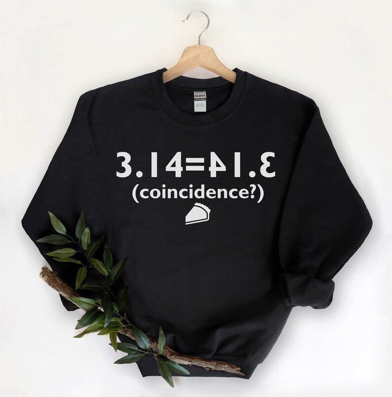 May include: Black sweatshirt with white text that reads "3.14=PI.E (coincidence?)" and a white pie slice icon.