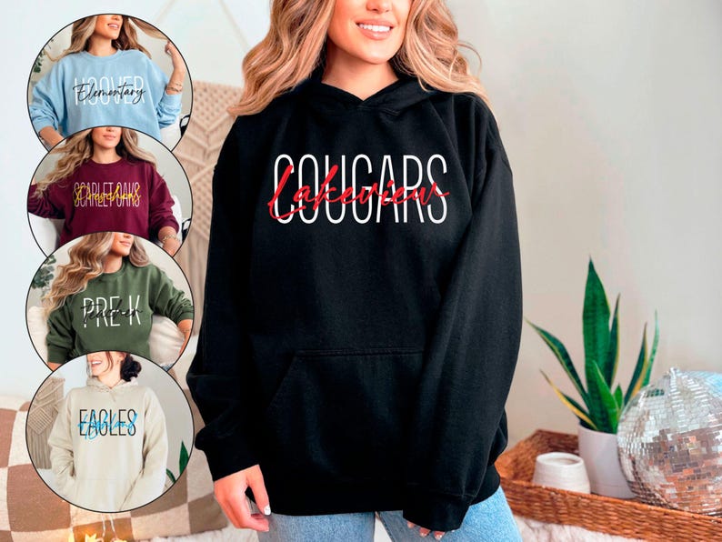 May include: Black hooded sweatshirt with the text "Lakeview Cougars" in white and red lettering.