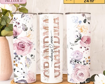 May include: Three stainless steel tumblers with floral designs. The center tumbler has the word "GRANDMA" written in gold glitter with the text "mckenzie loves" underneath.