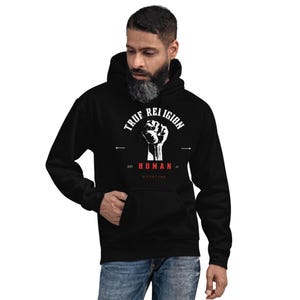 True Religion Human Raised Fist Hoodie, Unisex Black Graphic Sweatshirt, Activist Streetwear, Social Justice Gift, Urban Fashion Pullover