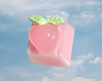 Ready-to-ship 3D peach on pastel 1u resin keycaps in the OEM keyboard profile for Cherry/Gateron switches