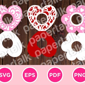 May include: A collection of heart and flower-shaped cutouts in pink, red, and white, each with a central hole. The designs include floral patterns and heart accents. Below are pink circles with the text "SVG", "EPS", "PDF", and "PNG".