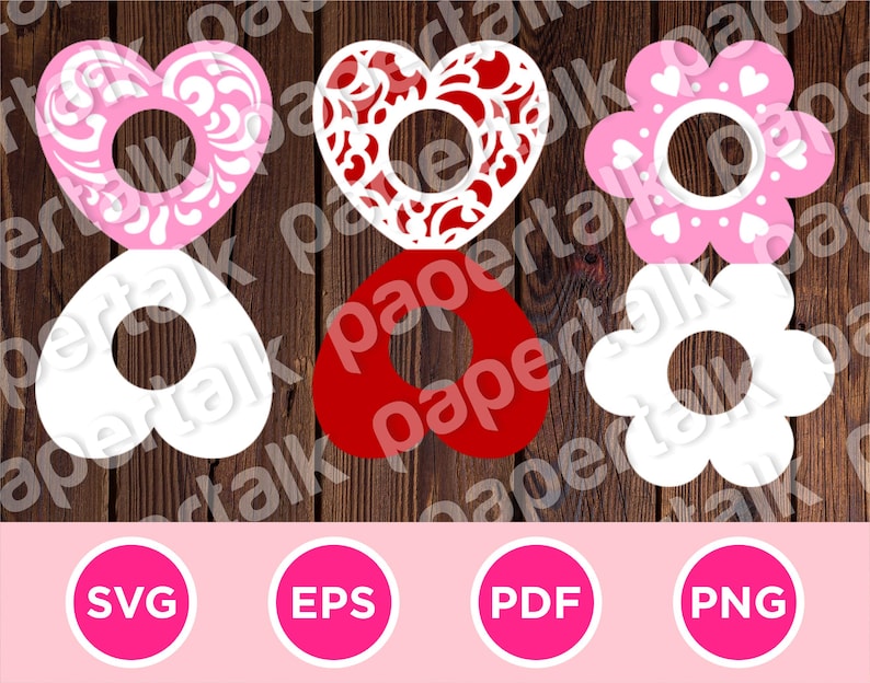 May include: A collection of heart and flower-shaped cutouts in pink, red, and white, each with a central hole. The designs include floral patterns and heart accents. Below are pink circles with the text "SVG", "EPS", "PDF", and "PNG".