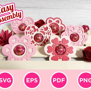 May include: Pink and red paper flower-shaped and heart-shaped holders with Lindor chocolate candies inside. The words "Easy Assembly" are in the top left corner. The bottom of the image has SVG, EPS, PDF, and PNG icons.
