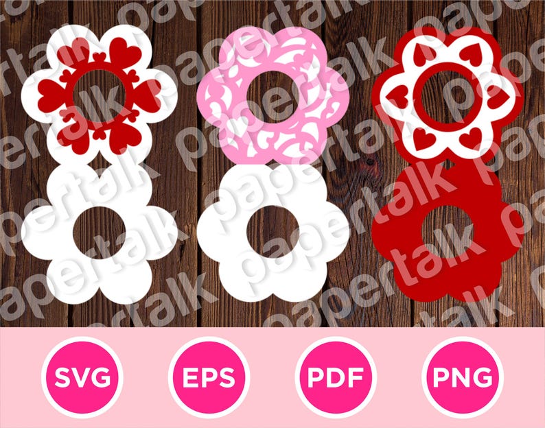 May include: A collection of flower-shaped cutouts in white, pink, and red, with heart and floral patterns. The image includes SVG, EPS, PDF, and PNG file type icons, suggesting digital design resources. The cutouts are arranged on a wooden background.