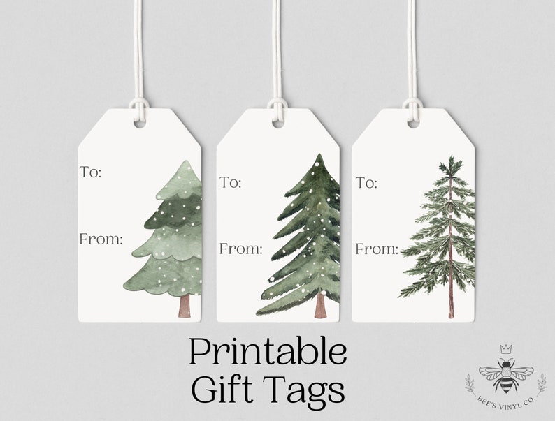 May include: Three printable gift tags featuring watercolor illustrations of green pine trees with white snow. The tags have the words "To:" and "From:" printed on them.