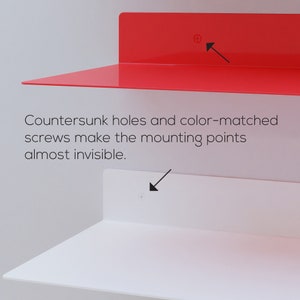May include: A red and white wall shelf design. The image shows a red shelf above a white shelf. The text in the image says, "Countersunk holes and color-matched screws make the mounting points almost invisible."