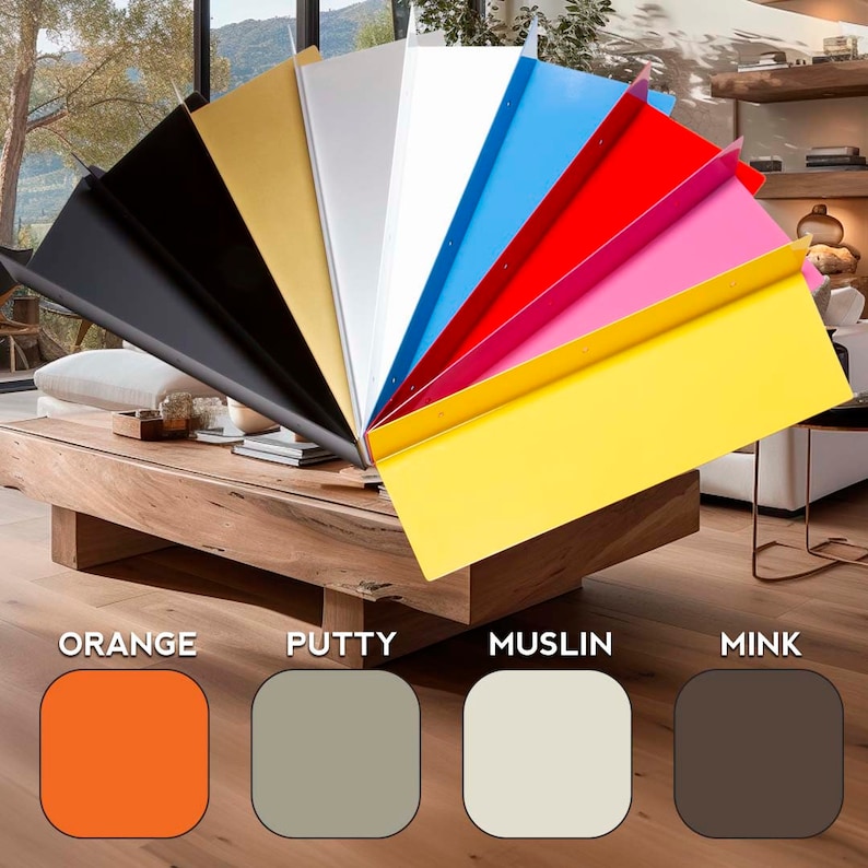 May include: A fan of colorful metal samples in various shades, including black, gold, white, blue, red, pink, and yellow. The samples are arranged on a wooden coffee table. Below the samples are color swatches labeled "ORANGE", "PUTTY", "MUSLIN", and "MINK".