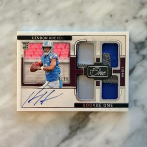 May include: A rustic wooden sign with the text "Welcome to our home" in white lettering. The sign features a distressed finish and a simple, inviting design, perfect for front door decor.