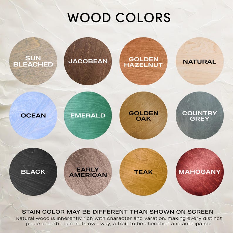 Wood color and letter color chart displayed on a light wall. Twelve square wood stain samples are shown with labels, including natural, dark, grey, and warm tones. Below them, two square letter color samples show black and white options.
