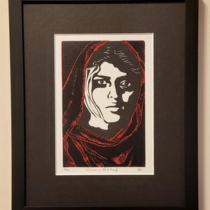 The "Woman in the Red Scarf" is a limited edition hand made linocut print.