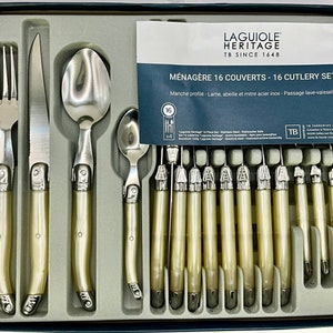 Brand new set of 16 Laguiole Heritage cutlery with a slightly translucent ivory coloured polypropylene handles.