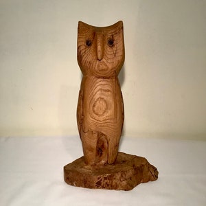 Lovely French hand carved wooden owl figurine statue standing on a rustic wooden plinth.