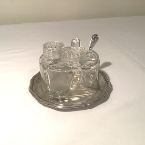 Stunning French vintage glass and silver metal condiment set consisting of salt and pepper shaker and a mustard / condiment dish with spoon.