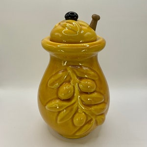 French vintage Vallauris hand made ceramic Barbotine Majolica olive pot with wooden olive spoon.