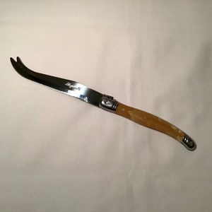 French LAGUIOLE cheese knife with a light brown coloured handle in very good condition new and unused.