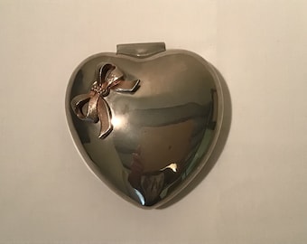 French vintage heart shaped silver metal jewellery box / trinket box with a bow on the top.