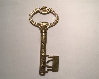 Stunning French vintage ornate solid brass chateau key bottle opener and cork screw.