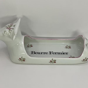 Beautiful French vintage ceramic cow shaped butter dish.