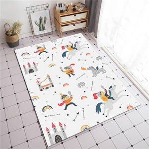 May include: White play rug with a repeating pattern of knights, dragons, castles, stars, and arrows. The rug has a white background with colorful accents.