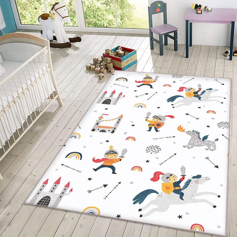 May include: White rug with a repeating pattern of knights, castles, rainbows, stars, and arrows. The knights are wearing red and yellow armor and riding horses or dragons.