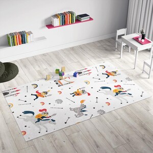 May include: A white play mat with a colorful knight and dragon design. The mat features knights riding horses, dragons, castles, rainbows, and arrows.