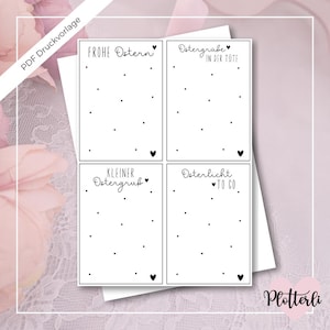 Könnte beinhalten: Vier druckbare Osterkarten-Designs mit schwarzem Text und Herzen auf weißem Hintergrund. Die Designs beinhalten "Frohe Ostern", "Ostergrabe in der Tute", "Kleiner Ostergrus" und "Osterlicht to go".