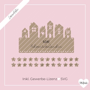 May include: A brown wooden Advent calendar with a row of houses and the text "NAME Adventkalender". The calendar has 24 numbered stars for each day of Advent.