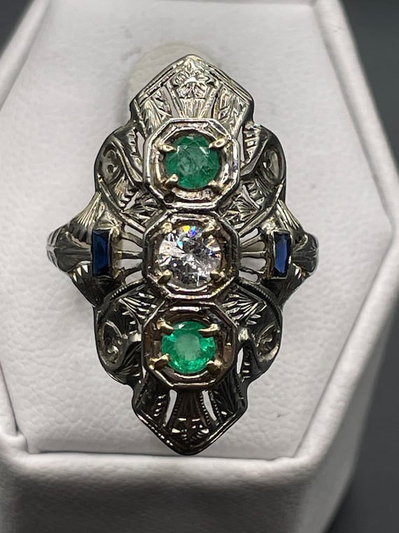 Antique Edwardian 1/3 carat diamond, emerald and s