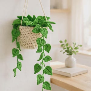 May include: A white ceramic mug with a black handle and the text "But First, Coffee" in a black, bold font. The mug is on a white surface.