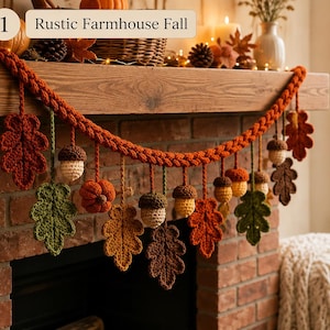 May include: A crochet garland featuring orange, brown, green, and yellow yarn leaves, acorns, and a small pumpkin hanging from a thick braided orange cord. The garland includes a label with the text 1 Rustic Farmhouse Fall.