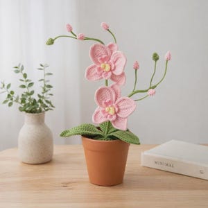 May include: A set of three ceramic mugs with a speckled, matte finish. Each mug features a different color: light blue, cream, and gray. The mugs have a simple, modern design and a comfortable handle.