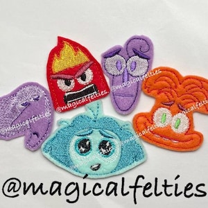 May include: Five felt appliques of characters from the movie Inside Out. The characters are Joy, Sadness, Anger, Fear, and Disgust. The appliques are all in different colors and have embroidered details. The appliques are all about 2 inches tall. @magicalfelties