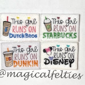 May include: Four rectangular white felt patches featuring embroidered designs. Each patch displays the text "This girl RUNS ON" with a specific brand name: "DUTCH BROS" in blue, "STARBUCKS" in green, "DUNKIN" in orange, or "DISNEY" in black.