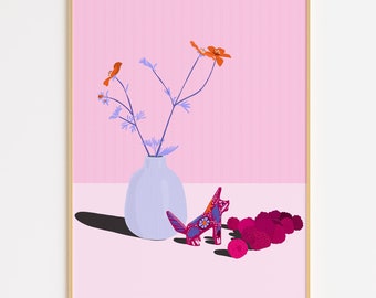 May include: A framed art print featuring a still life composition. A light blue vase holds orange flowers with purple stems. A decorative fox figurine with floral patterns sits next to a pile of pink berries. The background is pink and white.