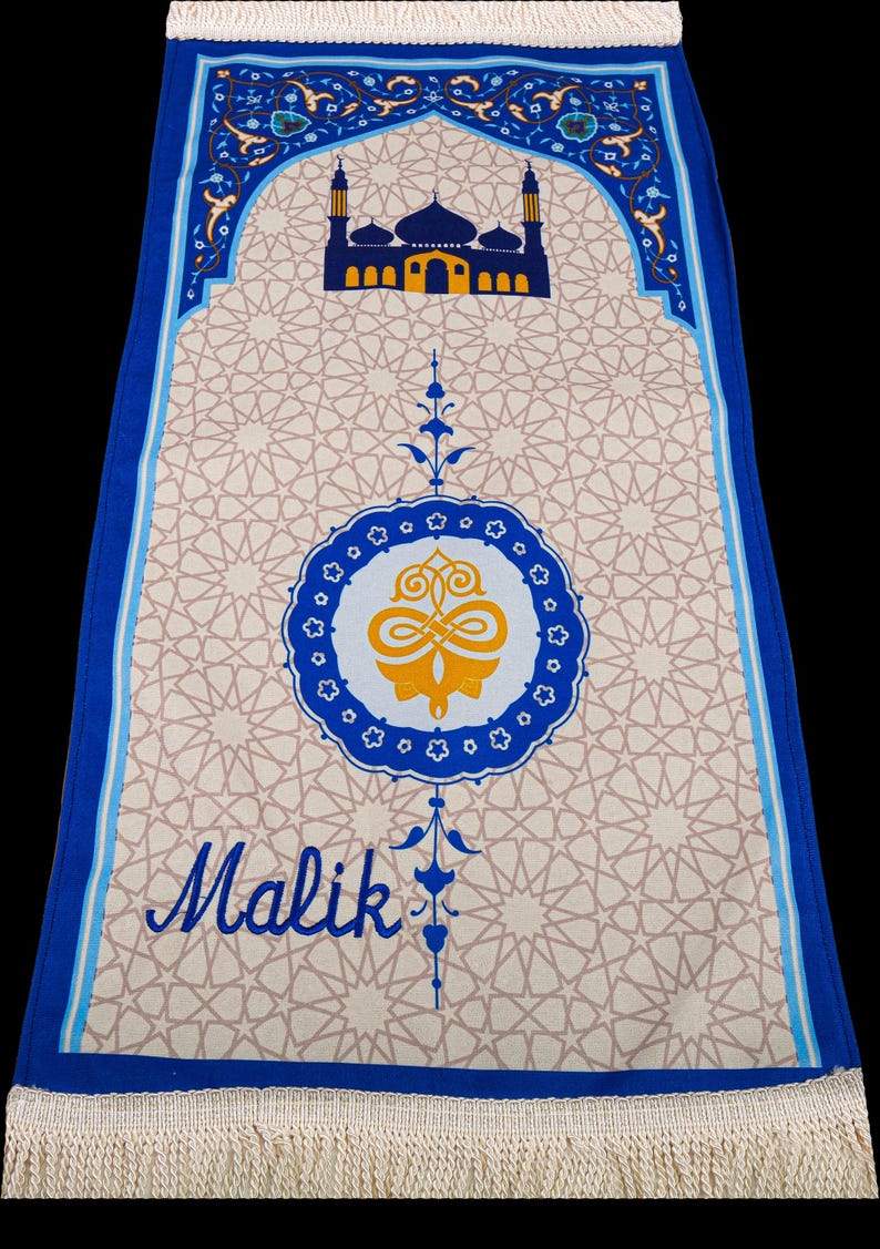 May include: A prayer rug with a beige geometric pattern and a blue border. The rug features a mosque illustration and the name "Malik" in script. The design includes a central medallion and decorative floral elements.