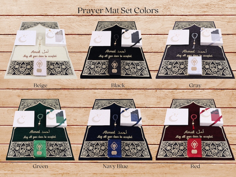 May include: A set of prayer mats in six different colors: beige, black, gray, green, navy blue, and red. Each mat features a traditional Islamic design with gold accents and includes a matching prayer rug, prayer beads, and a small box. The text on the mats reads "Ahmed" and "Amal" in Arabic, with the English translation "May all your deeds be accepted."