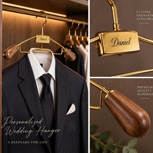 May include: A gold-toned metal clothes hanger with dark wood shoulder ends and a central rectangular plate engraved with the name Daniel. The hanger supports a black suit jacket, white dress shirt, and black tie. Text reads Custom Engraving Available.