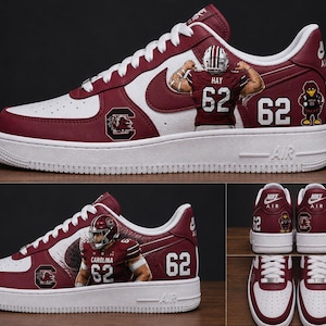 May include: Maroon and white low-top sneakers featuring custom graphics of a football player wearing jersey number 62, the text 'HAY', 'CAROLINA', and '62', along with a mascot logo and the Nike Air logo on the heel and tongue. The shoes have white laces.